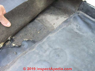 Peeled back rubber roof seam to explore leak area (C) Daniel Friedman at InspectApedia.com
