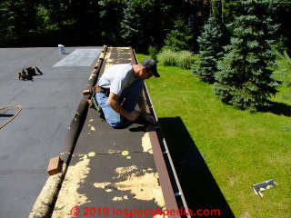 Rubber EPDM roof repair: mating a new EPDM run below the older existing rubber roofing - failed (C) Daniel Friedman at InspectApedia.com