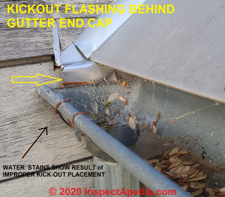 Kick-out flashing at a gutter abutment to side wall (C) Daniel  Friedman at InspectApedia.com
