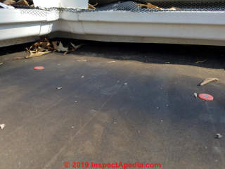 Rubber roof flashing at flat-to-wall  intersection (Larry Grossman (C) InspectApedia.com