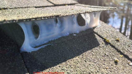 Confirming that our cold weather sealant was bonding well to the asphalt roof shingle surfaces (C) Daniel Friedman at InspectApedia.com