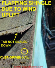 Flapping aspalt shingle caused by combination of failure to seal and wind uplift at gable end (C) Daniel Friedman at InspectApedia.com