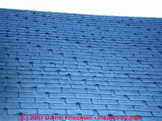 Fishmouthing wear pattern on asphalt roof shingles