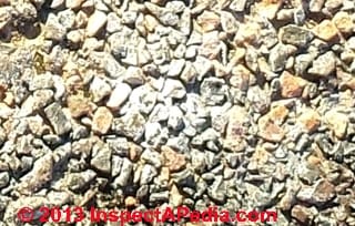White stain material found on asphalt shingles (C) InspectApedia - & JM