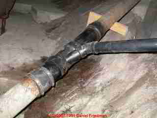 Photograph of sewer line leak in a basement/crawl area during drain clog diagnosis