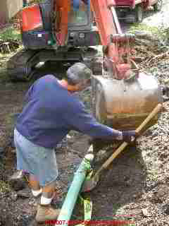 Excavation to install a deep trench septic field at a New York home (C) Daniel Friedman at InspectApedia.com