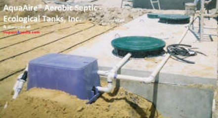 Ecological Tanks Inc Aqua Aire aerobic septic system during installation, cited at InspectApedia.com (C) Ecological Tanks / InspectApedia.com