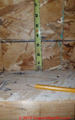 Marking the height of the round hole cut line for the Cinderella air inlet pipe  - (C) Daniel Friedman at InspectApedia.com