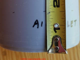 Measuring inset length of Cinderella vent or exhaust pipes - (C) Daniel Friedman at InspectApedia.com