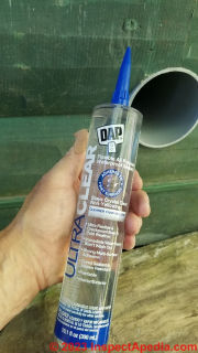 DAP Ultra Clear paintable sealant used to seal the Cinderella vent pipes at the building exterior wall  - (C) Daniel Friedman at InspectApedia.com
