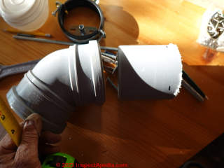 Preparing a close nipple of 4-inch plastic to add the 45 degree angle elbow to a Cinderella toilet vent  - (C) Daniel Friedman at InspectApedia.com