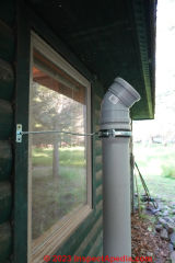 Lower incinerating toilet exhaust vent (chimney) ready to install angled extension to clear the roof edge / eaves / soffit  - (C) Daniel Friedman at InspectApedia.com