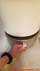 Cleaning the Cinderella toilet (C) Daniel Friedman at InspectApedia.com