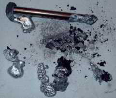 Melted copper rod dropped into incinerating toilet (C) WombatNation.com used with permission InspectAPedia.com
