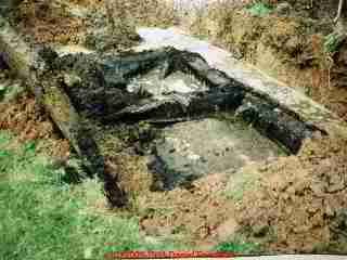 Photograph of  rusted out and dangerous steel septic tank