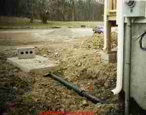 Photograph of a collapsing, failed steel septic tank.