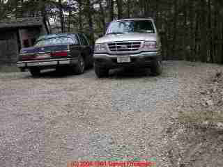 Photo of parking lot
atop a possible drainfield location - likely to ruin the field by compacting the soils.