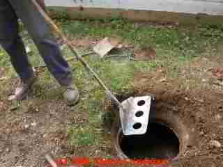 How to check septic tank sludge level