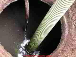 PHOTO of an septic tank during tank pumping.
