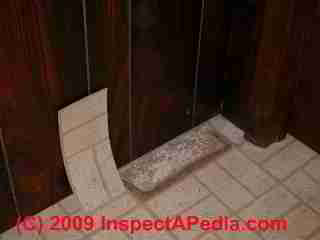 Brick floor tile pattern containing asbesto (C) InspectApedia.com
