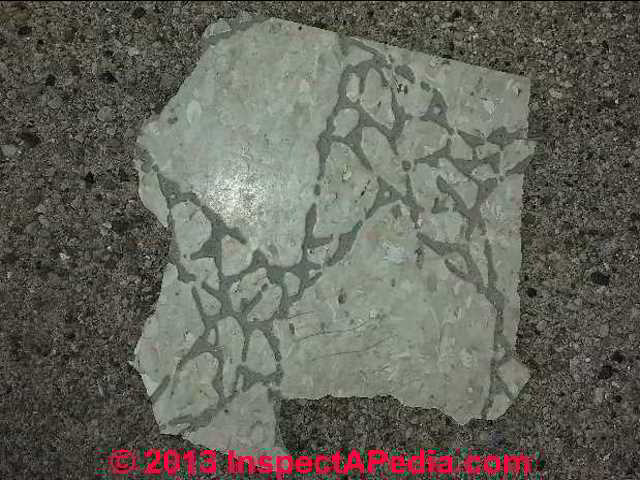 Presumed asbestos containing vinyl floor tile (C) InspectApedia