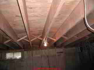 Photograph of a basement ceiling after cleaning by media blasting.