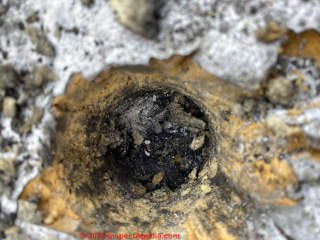 tar and gravel on roof sheathing (C) InspectApedia.com Matt Q