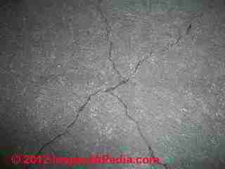 Cracks in a concrete slab in an Alaska home over thawing permafrost © D Friedman at InspectApedia.com 