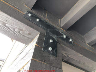 Checking at bolt connection of post & b eam framing (C) InspectApedia.com Marks
