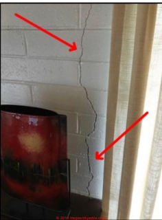 Vertical crack in concrete block wall near building corner (C) InspectApedia.com Mike