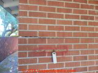 Damage to a brick veneer wall Southwest US b 1957 (C) InspectApedia.com RD