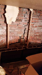 Severe damage to brick wall - unafe (C) InspectApedia.com Rob