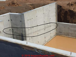 Cold pour joint lines in a new concrete foundation wall during construction (C) InspectApedia.com Chad