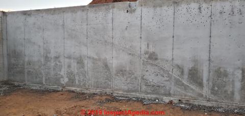 Cold pour joint in new concrete foundation wall (C) InspectApedia.com newhome73
