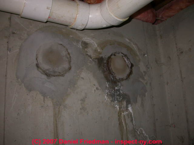 Photograph of holes in poured concrete © Daniel Friedman at InspectApedia.com