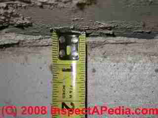 Photograph of a basement floor slab crack