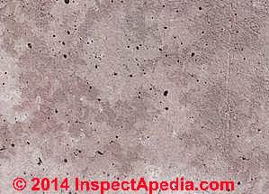 Air bubbles pockets bug holes in concrete poured wall, Nigeria (C) InspectAPedia CI