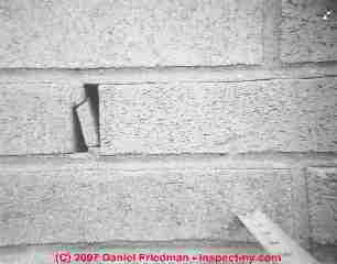 Photograph of thermal expansion damage to a brick wall