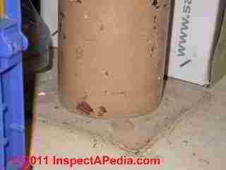 Severe rust damage to steel column © Daniel Friedman at InspectApedia.com