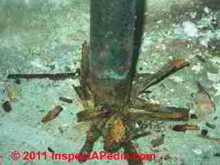 Crushing steel lally column © Daniel Friedman at InspectApedia.com
