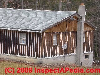 Vertical log wall home © Daniel Friedman at InspectApedia.com