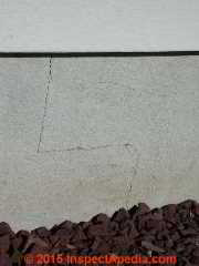 Hairline step cracking in cinder block wall © Daniel Friedman at InspectApedia.com