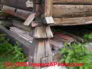 Details for avoiding rot and insect damage at log ends in an antique log wall © Daniel Friedman at InspectApedia.com