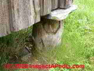 Details for avoiding rot and insect damage at log ends in an antique log wall © Daniel Friedman at InspectApedia.com