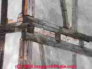 Post and beam construction, brick infill © Daniel Friedman at InspectApedia.com
