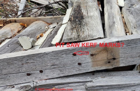 Possible pit saw marks help give age of dimensioned lumber on this antique and now collapsed Michigan log home (C) Daniel Friedman at InspectApedia.com