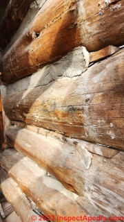 Wood strips & cement chinking on a Michigan log home (C) Daniel Friedman at InspectApedia.com