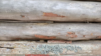 Wood strips & cement chinking on a Michigan log home (C) Daniel Friedman at InspectApedia.com