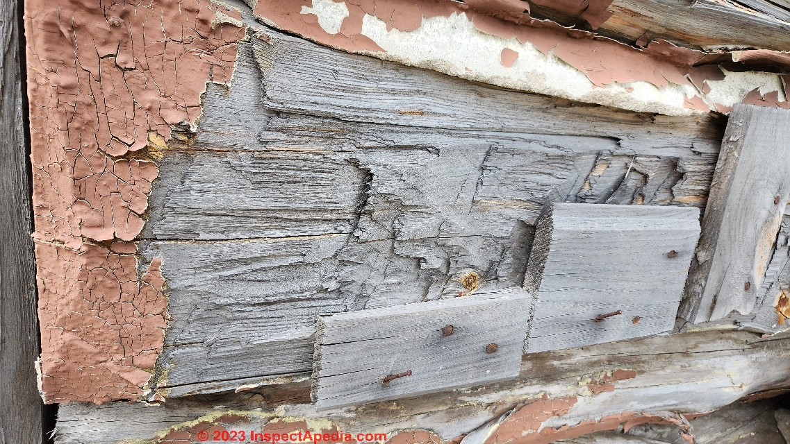 Tool marks indicate hand hewn logs on this Michigan log cabin (C) Daniel Friedman at InspectApedia.com
