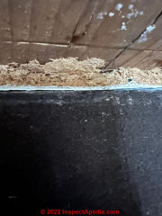 Fiberboard demolition vs. asbestos exposure (C) InspectApedia.com Ben